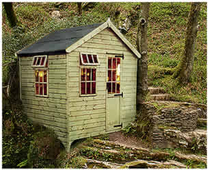 shed on a rocky riverside path